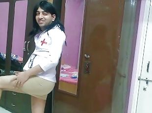 Sexy sissy crossdresser nurse removes her skirt in a clinic in the ...