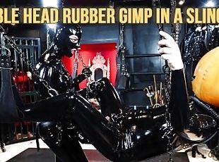 Bubble Head Rubber Gimp in a Sling - Heavy Rubber Dominatrix strap-...