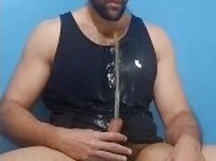Brazilian bearded man plays with his soft cock pissing on his chest...