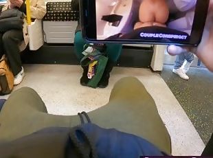 Watching Porn And Wanking Him Off On The Undergorund