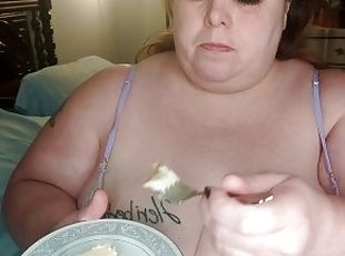 Watching my step mom eat in her sexy lingerie with her big tits han...