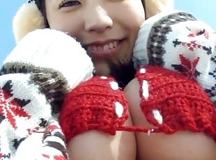 Sweater girl models a knit bikini in the snow