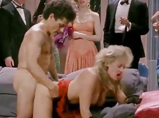 Retro people are watching horny couple fucking hard at party