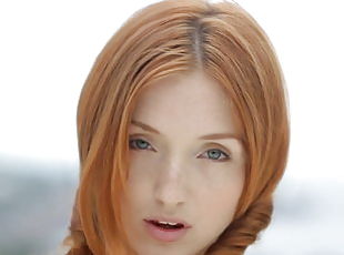Young redhead teen Michelle posing