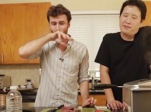 Good looking dude having fun with his friends in the kitchen