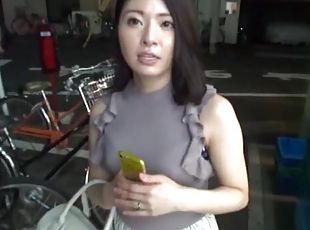 Japanese woman enjoys while being pleasured in the back of a van
