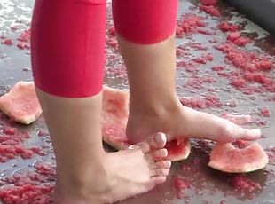 feeding with water melons from feet