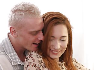 Russian redhead Angie moans while being fucked by her man