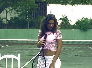 Beautiful solo brunette pleasuring her cunt on a tennis court