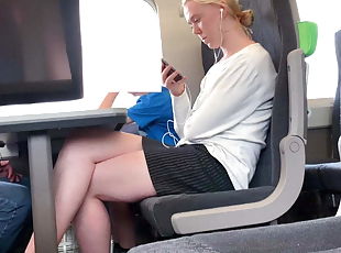 Blonde with beautiful legs on the train