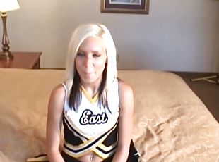 Blonde girl in a cheerleader outfit moans while being fucked hard