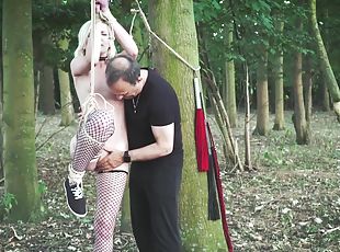 Collared slave foil wrapped to a tree