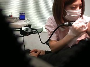 Asian nurse pleases a patient by jerking his stiff pecker