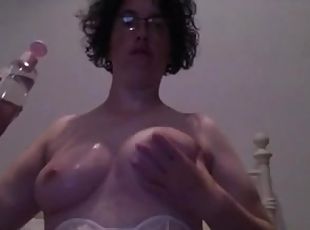 Nerdy amateur milf oils and rubs her big natural tits in homemade solo