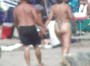 Curvy MILF and her boyfriend on the beach