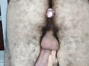 leaking a lot of pre cum while having a anal plug
