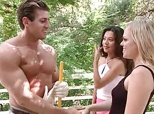 Two gorgeous babes are having sex with a jacked guy
