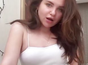 Homemade video of a solo brunette fingering her pussy. HD