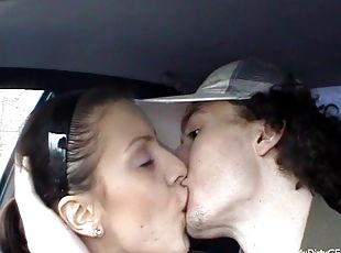 Sexy brunette teen giving her horny guy superb blowjob in the car