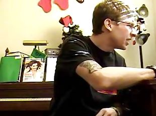 Tattooed boy in glasses jerks off solo