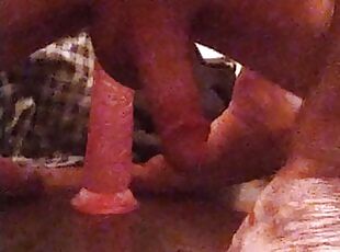 Small penis jiggles riding 10 inch dildo