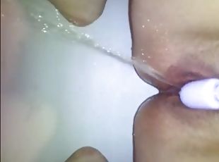 Babe rubbing clit with vibrator and squirt a lot
