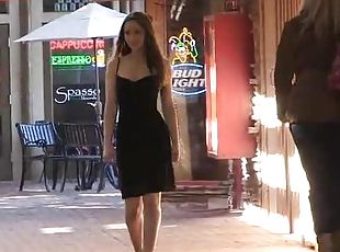 Sexy outdoor strip show by lovely babe Dani in black dress