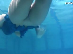 Blonde feher with big firm tits underwater