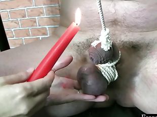 Blonde domina plays hard with bondaged dick and hot wax