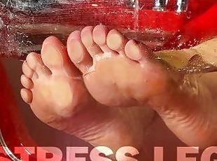 Mistress's wet wrinkled soles are pressed against the glass in the ...