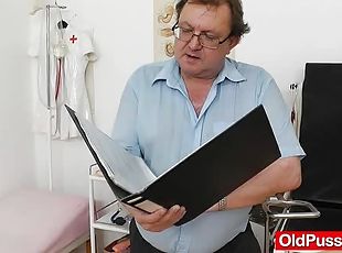 Mature redhead in pantyhose gets ass dildoed at the doctor's office