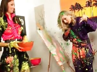 Clothed women make a mess with paint