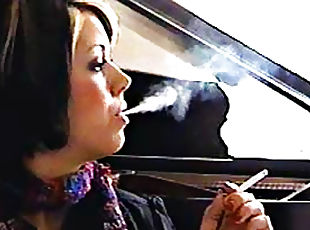 Girl in scarf smokes cigarette