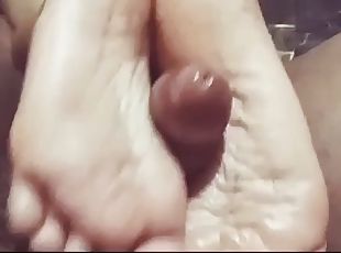 Cheating wife give a footjob to her bf