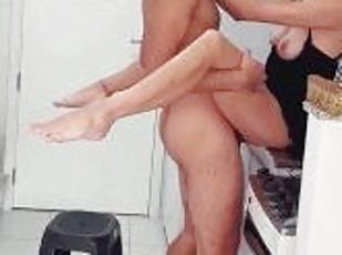 A hot passionate couple in love in the kitchen
