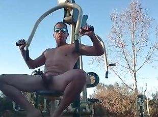 Horny muscle guy works out naked at a park nautilas.   Almost caugh...