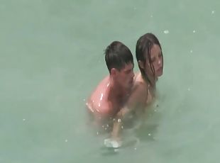 Naked couples caught fucking in the ocean