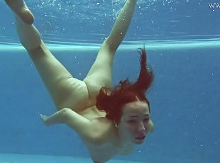 Teen goes swimming in lingerie and gets naked in the pool