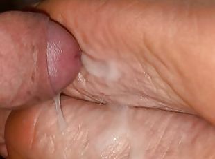 Very close up cock rub on very wrinkly soles