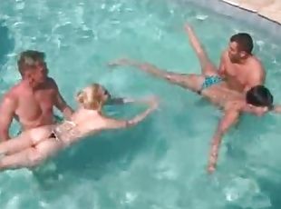 Bikini babes and their men fool around in pool