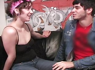 A hipster couple bangs their brains out on a leather couch