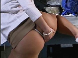 Brunette with big ass in thong giving cock blowjob in office