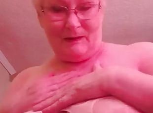Dirty granny granny plays with her huge boobs and shows her bunny t...