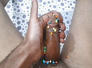 Masturbating with a chocolate dick decorated with Smarties. Wow, ho...