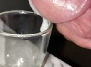 Squeezing milky cum out of the tip of my dick, shot glass collectin...