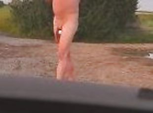 Barefoot nude at side of highway