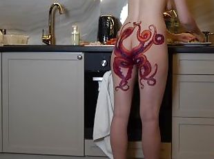 Naked housewife with octopus tattoo on ass cooks dinner