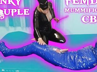 Femdom Goddess whips balls of mummified slave