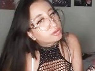 Little slut in a fishnet outfit has fun playing with her ass