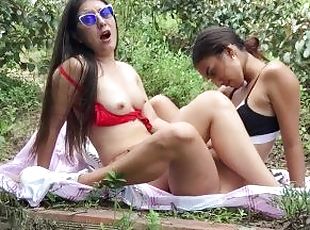 lesbians scissor outdoors